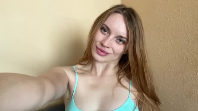 Pretty girl squeezes her tits.